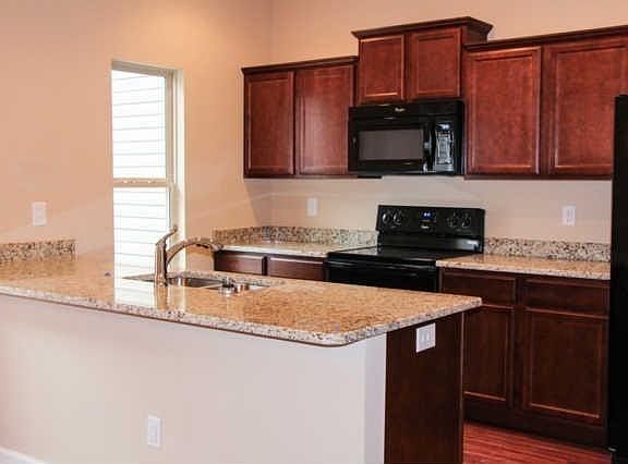 Lots of natural light shines into the kitchen and dining area... spacious kitchen with granite coun
