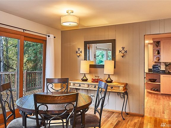 Eating or just get together space off the living area with slider out to the deck that over looks the private backyard.