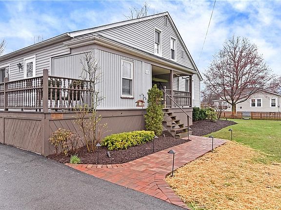New front-walk highlights the beauty of the house and the front yard.