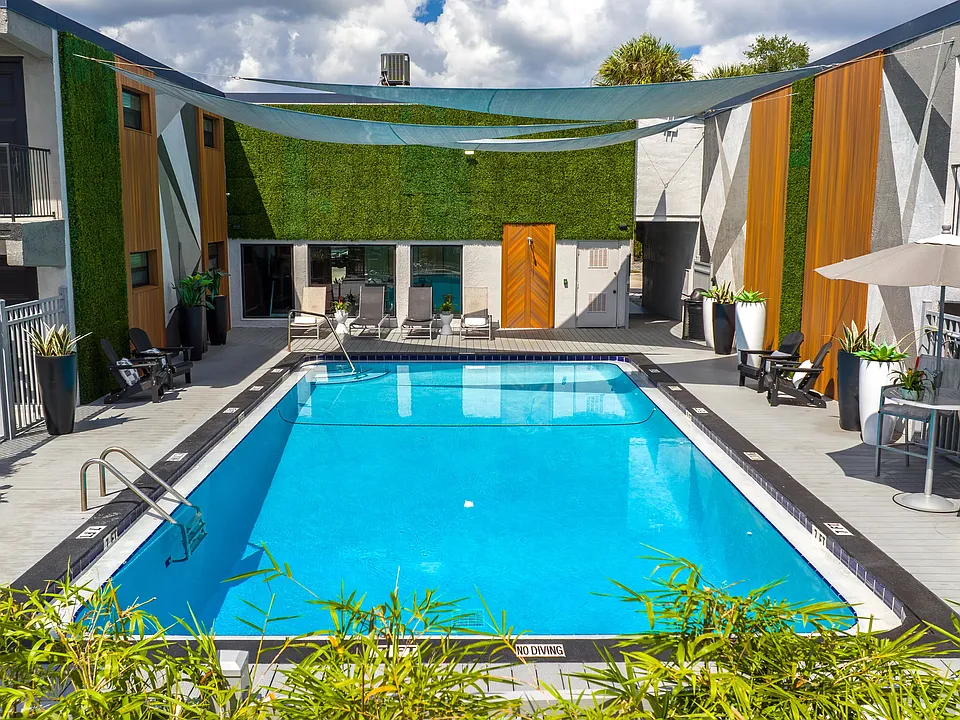 Experience a refreshing retreat at our beautifully designed pool area. Featuring sleek design, comfortable lounge seating, and vibrant landscaping, it's your go-to spot for unwinding or soaking in the Florida sun.