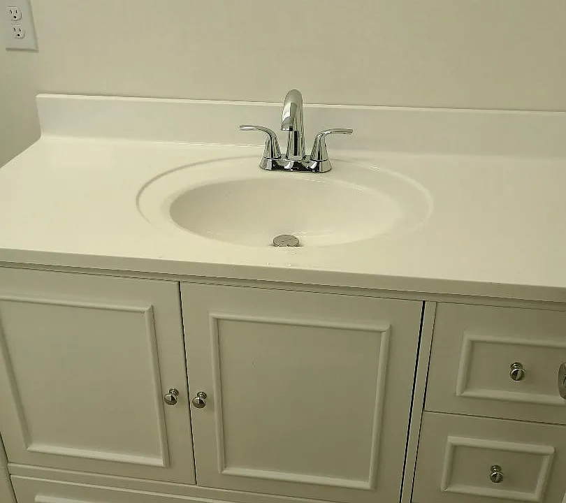 oversized vanity with granite countertop