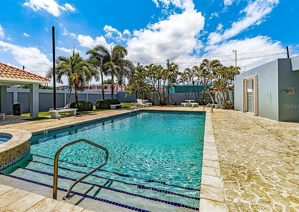 Beautiful pool with bathrooms for enjoying and entertaining. Also has a connected rentable community space.