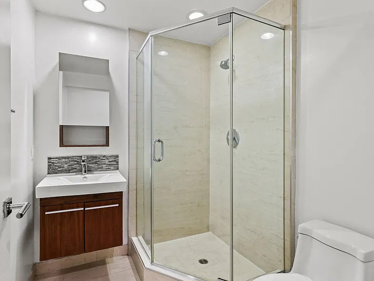 Bathroom with a Stand-Up Shower, SInk, and Toilet