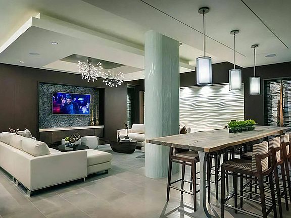 Clubhouse Lounge With Sofa Seating and Bar-Height Dining Table