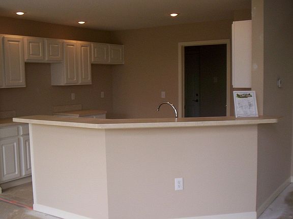 White cabinets & breakfast bar. 