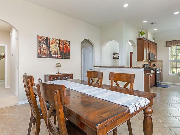A quaint dining space is the ideal place to enjoy a family meal or a card night with friends.