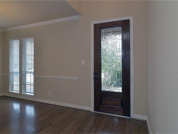 The gorgeous hardwood floors begin at the entry and flow through much of the ground floor.