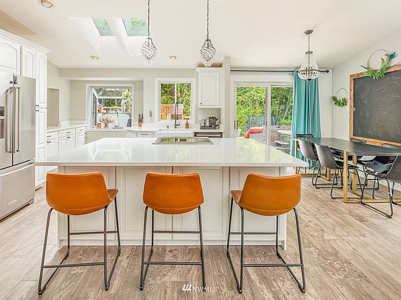 Large island, quartz counters, Daltile Italian Porcelian floors, white cabinets & new white millwork.