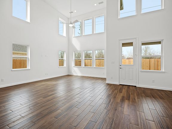 Great room dining area with two-story ceiling