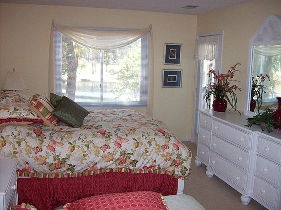 Master bedroom with window on golf course