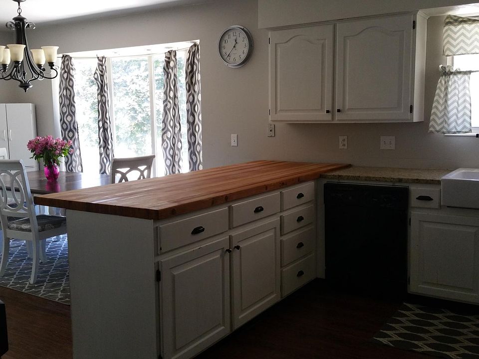 Kitchen with reclaimed butcher block peninsula