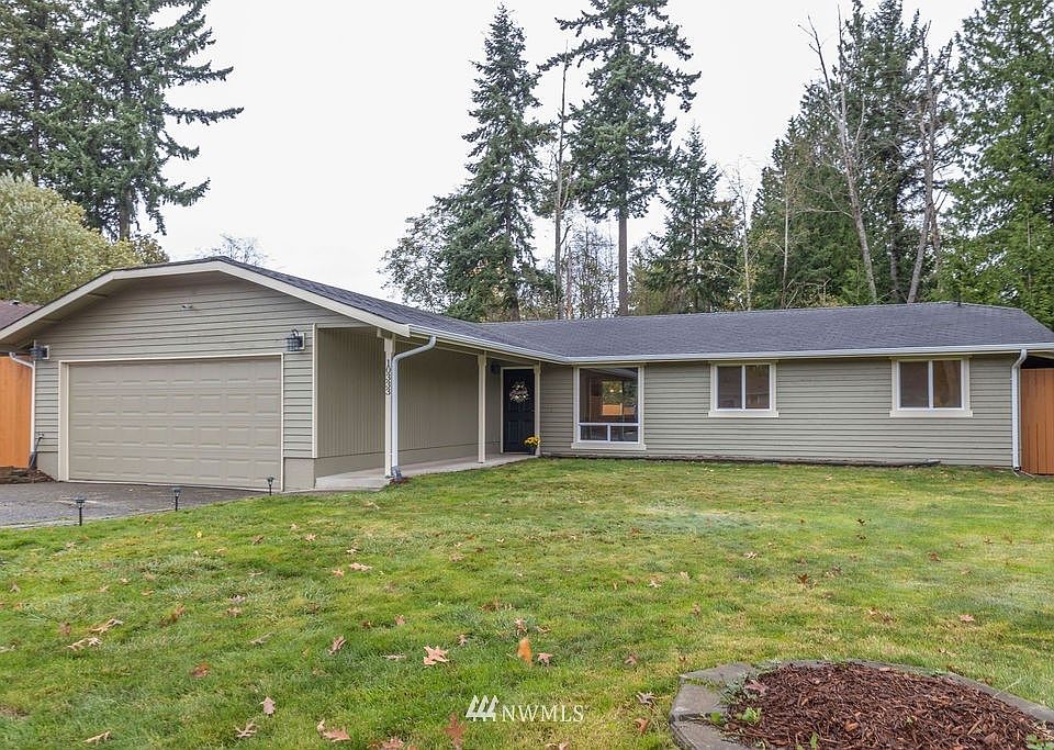 Large front yard with covered walking path to your front door.