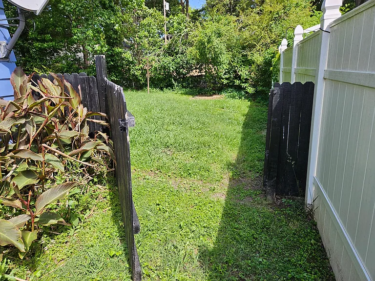 Gate into fenced back yard, from driveway
