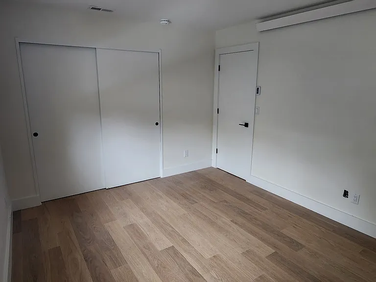 Bedroom - upper floor. 2 Bedrooms up and 2 down, all have their own heat and heat controls and closets and each has a window with blind