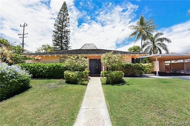 Beautifully landscaped 11,000 square foot property with lots of storage in a fantastic location