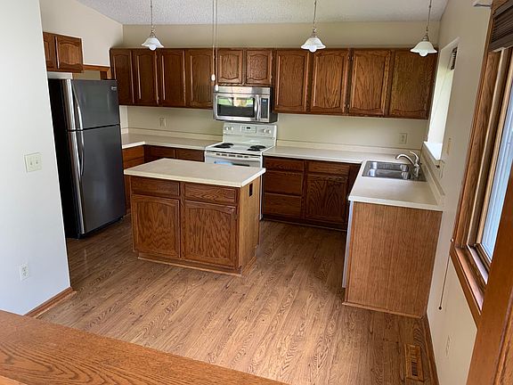 Large, bright kitchen with center island.