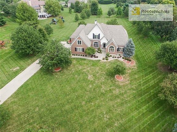 Brick home w/ side entry garage.