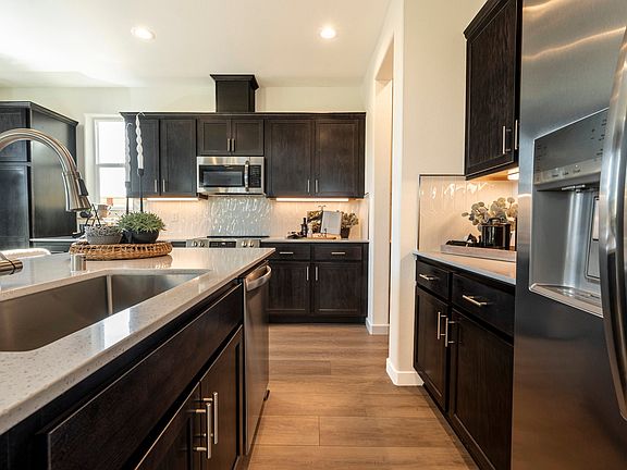 Kitchen features ample cabinets for plenty of storage space oversized stainless steel under mount