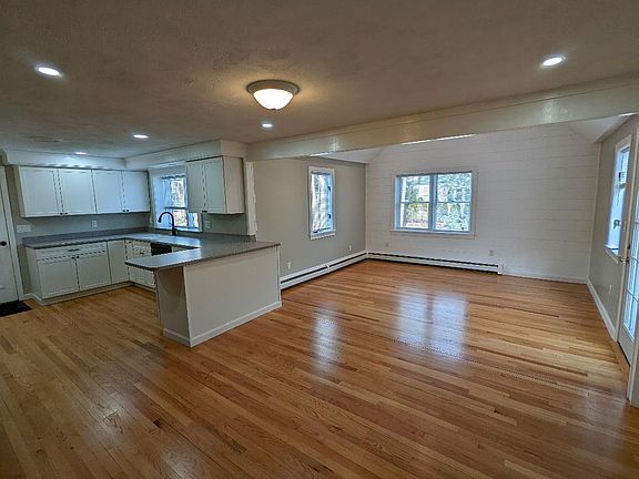 Absolutely impeccable kitchen, family room w cathedral ceiling. door to new sundeck.