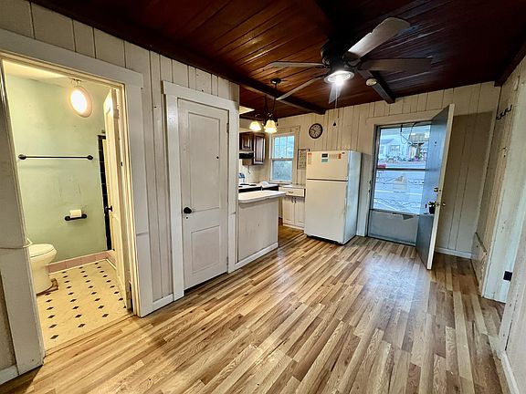 Open living, dining and kitchen area.