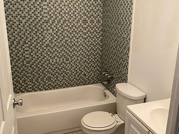 Bathroom with mosaic tile shower