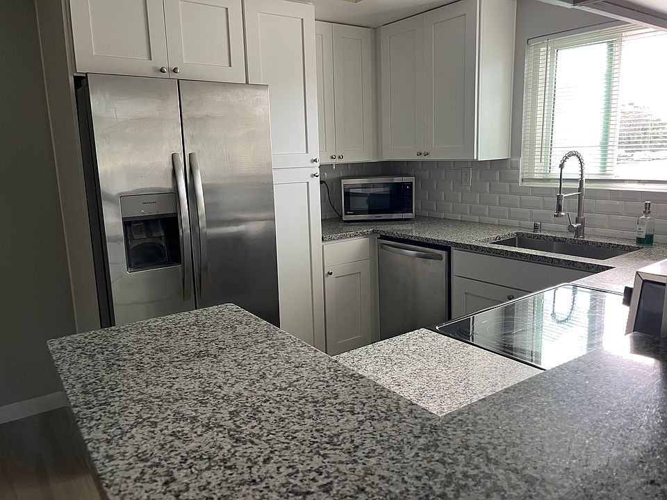 Renovated kitchen with new kitchen, countertops, and appliances