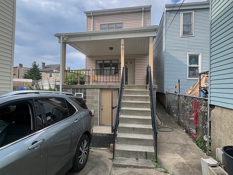 Stairs lead up to the front porch
