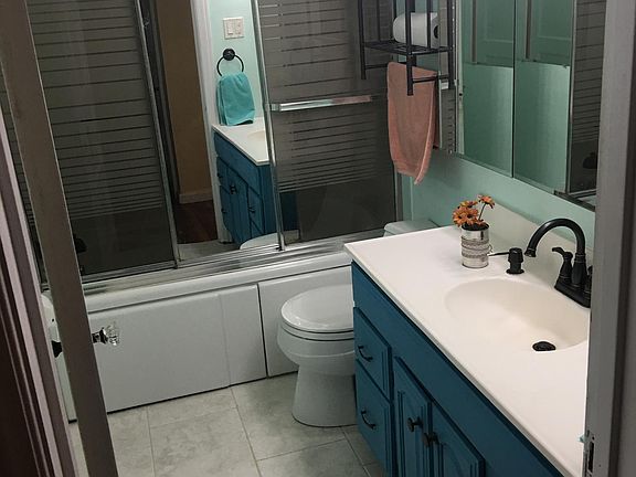 Bathroom, new floors and shower hardware, vanity painted