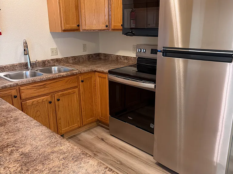 Kitchen, with new appliances, new sink, new faucet.