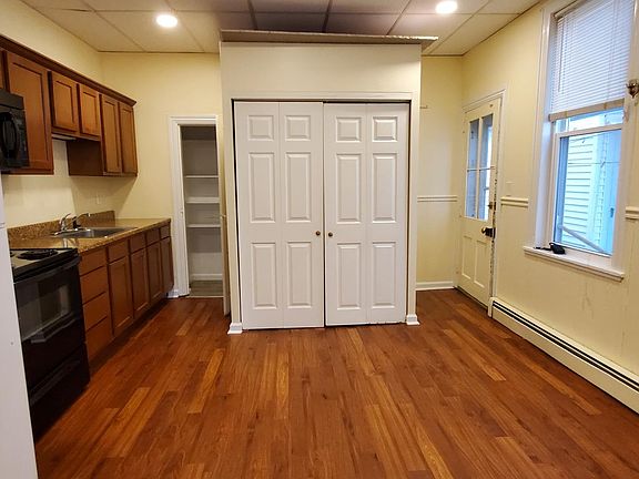 eati in kitchen w/ laundry inside closet doors.