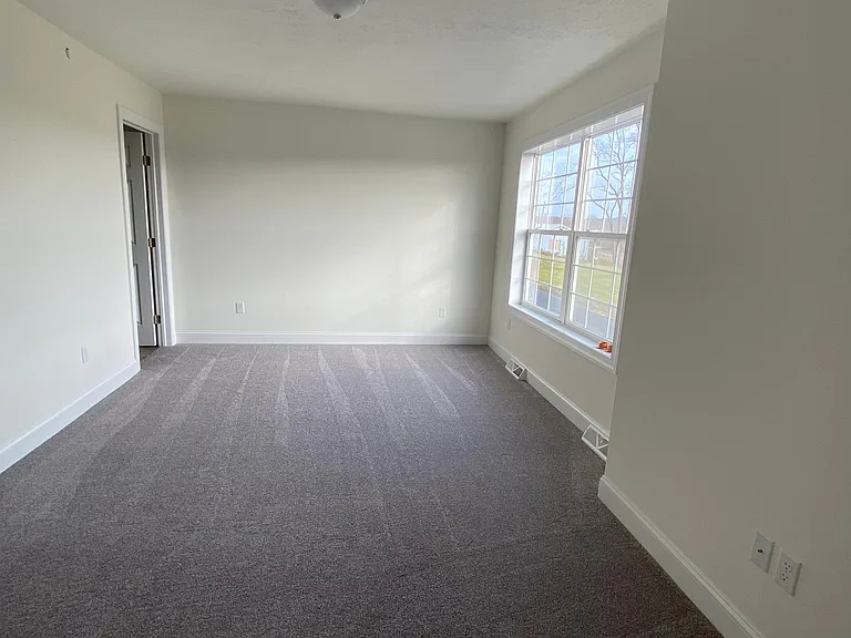 Master bedroom w large window