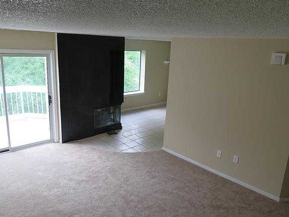 Living room Dining area and Fireplace from stairs