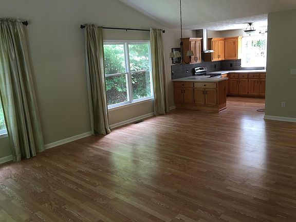 dining area and kitchen view in background