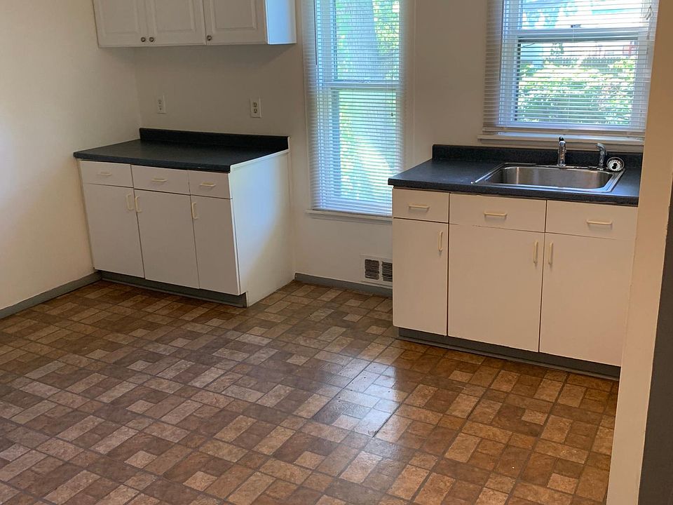 Eat in kitchen with stove and fridge