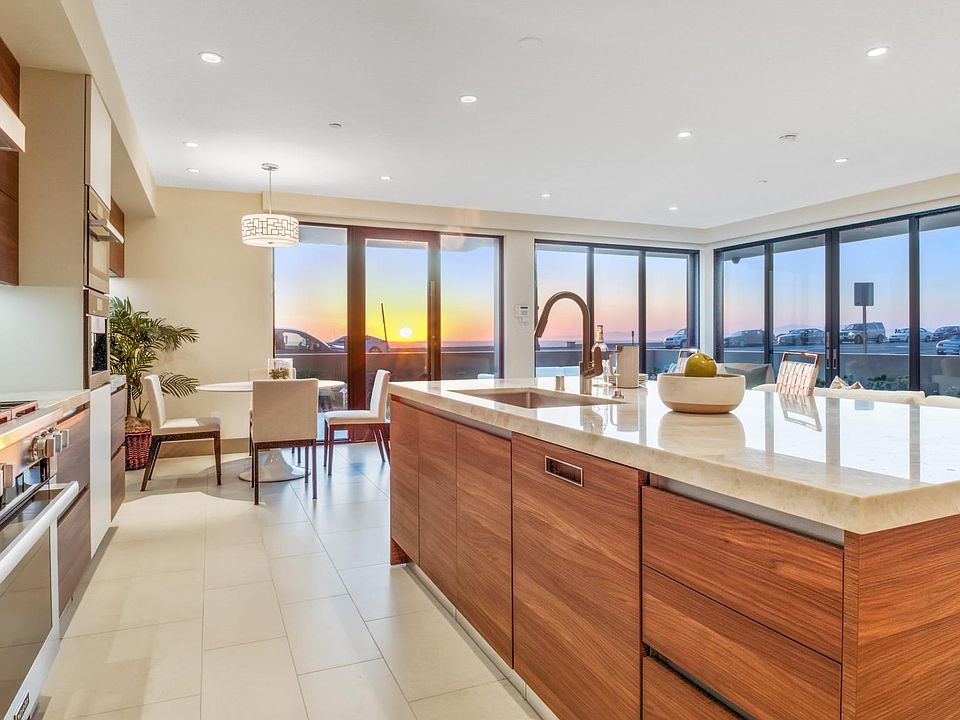 Open floor plan with Kitchen, Dining and Living Room / Two sets of sliders open to create a grand indoor outdoor space.