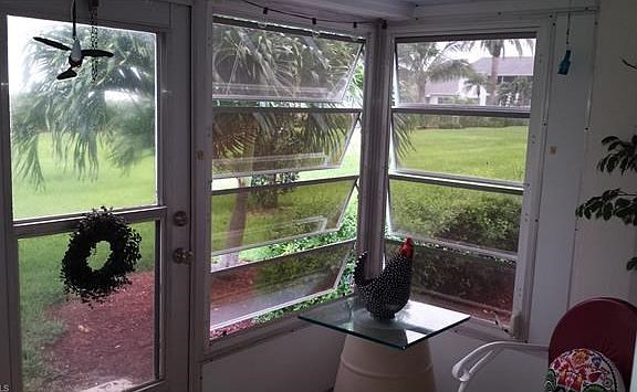 Lanai to Right with door onto landscaped yard. Steps from clubhouse and pool.