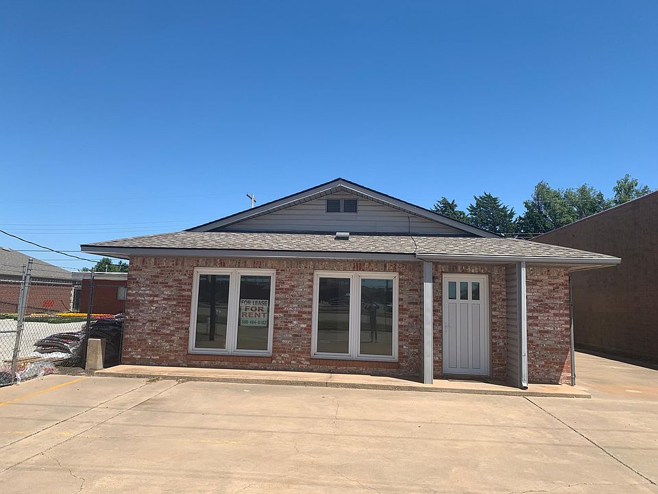 Front of building with parking