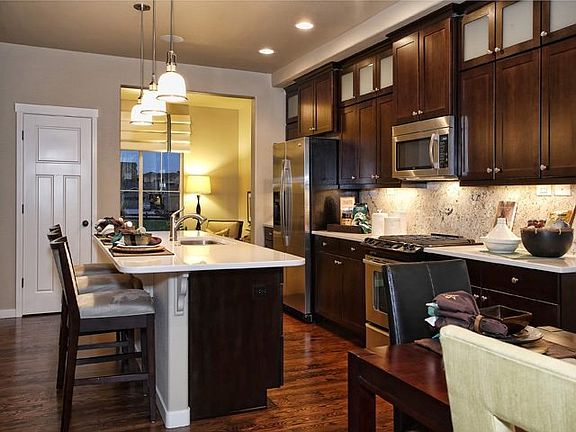 Expansive kitchen opens to a versatile flex space. Model of home to be built