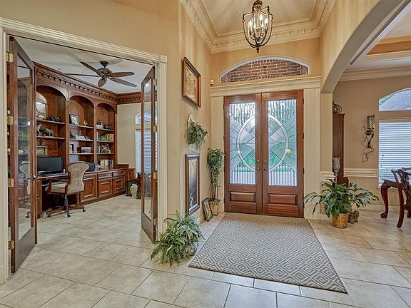 Enter into the welcoming foyer with home office and formal dining to admire.