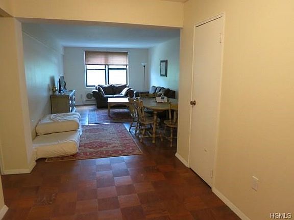 Large entry foyer leads to bright living room and dining area