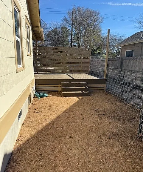 Enclosed side yard and deck.