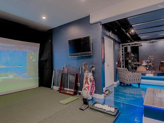 This home comes with a Foresight Golf simulator to use during your stay