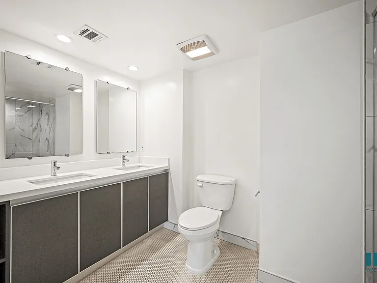 Bathroom with Walk-In Shower, Double-Sink, and Vanity Cabinet Storage