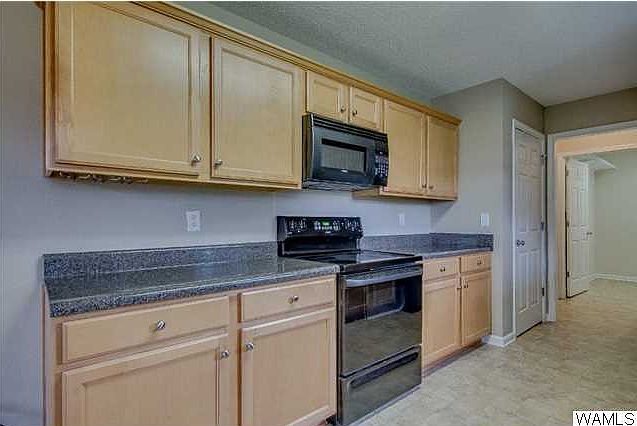 Flat surface stove with microwave. Lots of counter top surface.