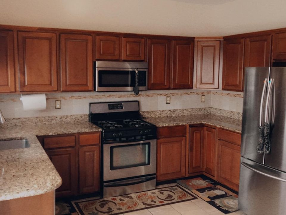 Stunning kitchen with plenty of cabinet space and granite counter