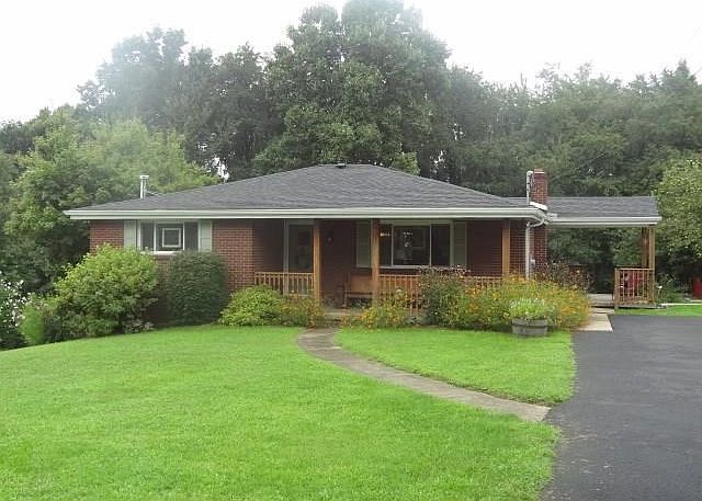 Welcome to 4011 Bushy Run Road.  Level entry all brick home.  So many updates.  Relax on either the front or side covered porche