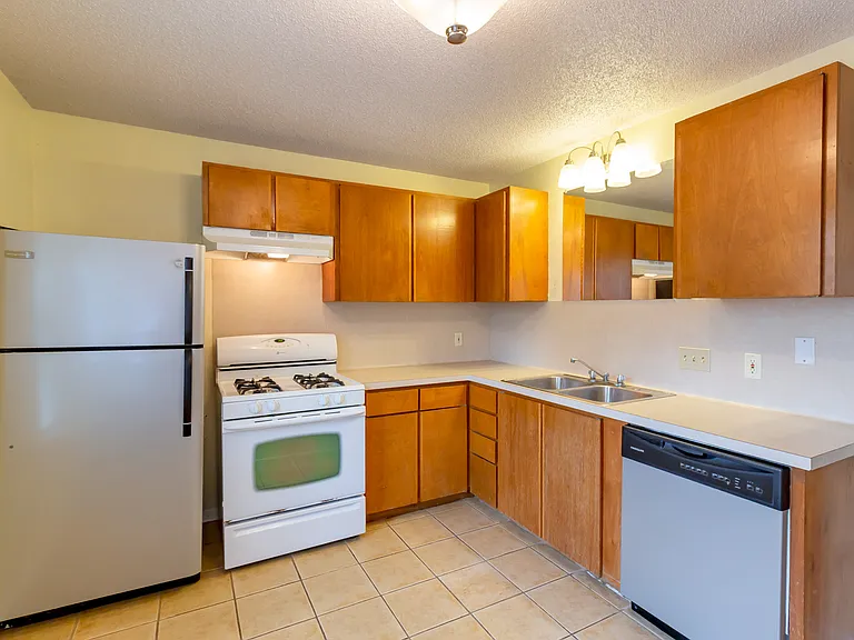 Kitchen off living area. Gas stove, disposal too