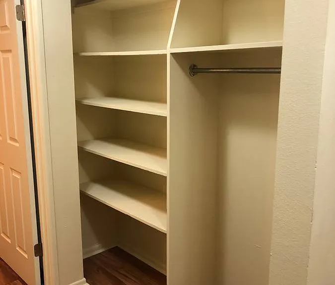 Maximize your storage with this beautifully designed open closet, perfect for efficient organization. Maximize your storage with this beautifully designed open closet, perfect for efficient organization.