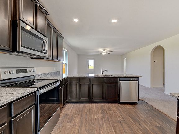 The spacious kitchen is perfect for preparing your family s favorite meals and treats.