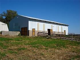 Well-maintained horse barn with access to the paddocks